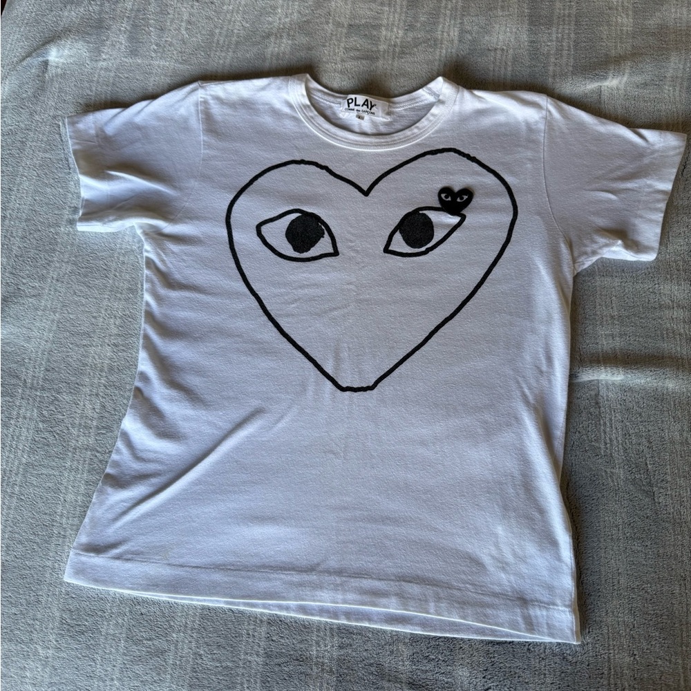 Comme des Garcons White Short Sleeve Tee with Black Heart-Eye Graphic